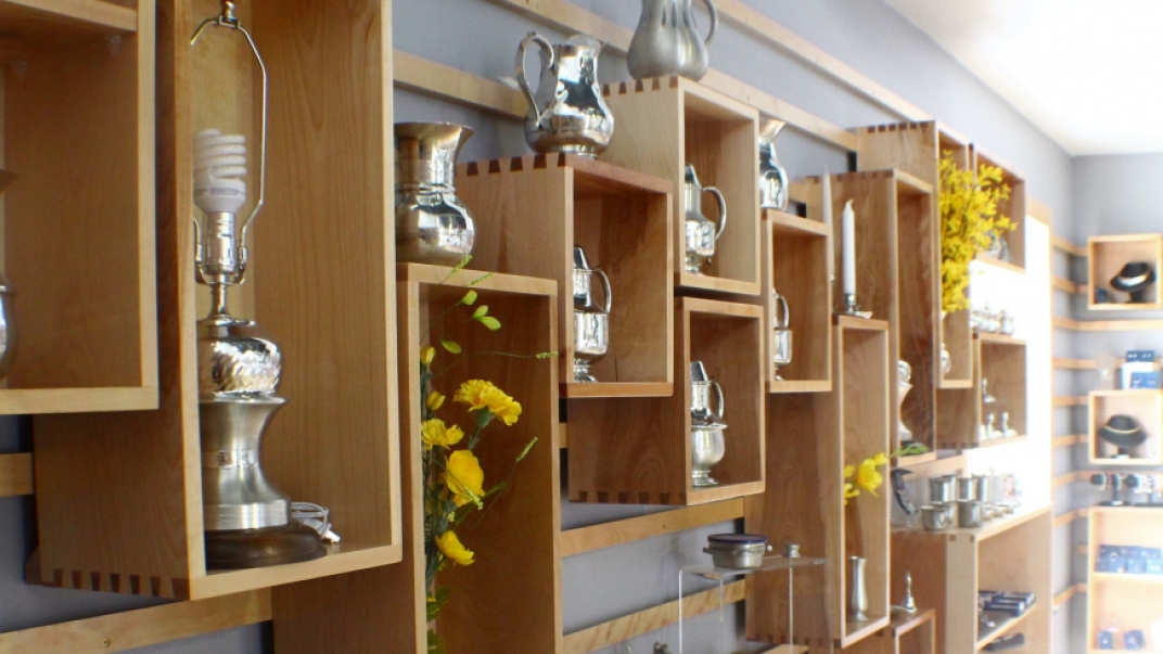 pewter silver items on shelves