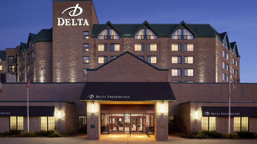 Delta Fredericton at night with welcoming lighting. 