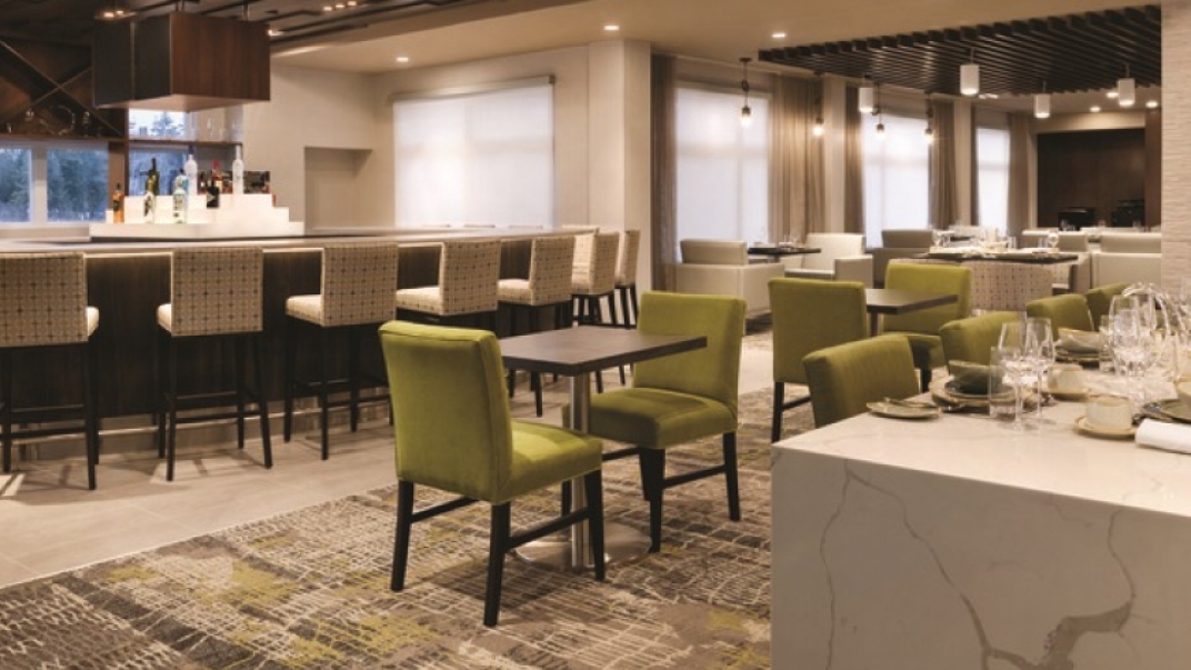 restaurant with white a green chairs