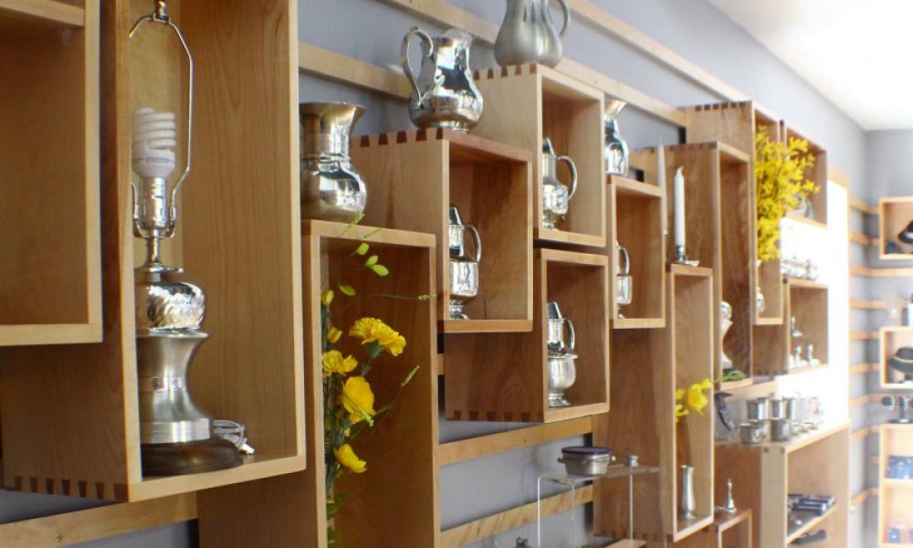 pewter silver items on shelves