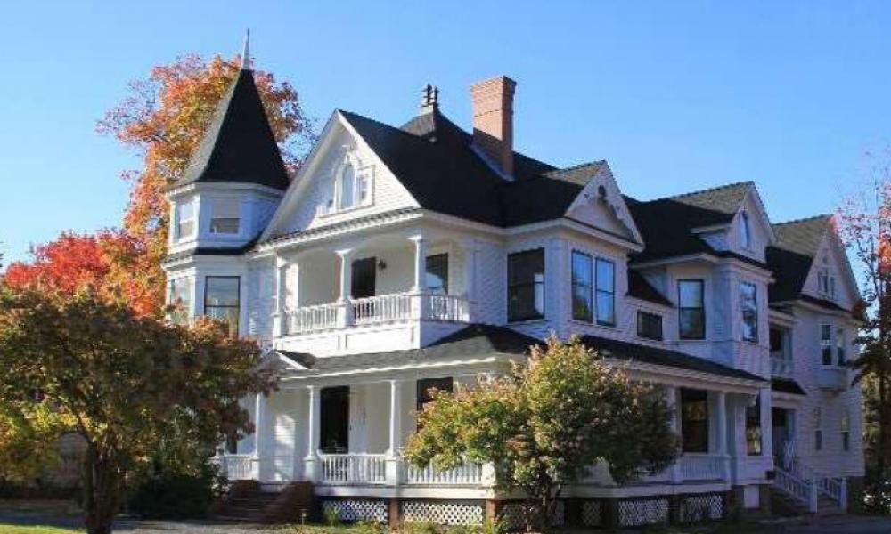 External shot of a white Victorian-style two-story house
