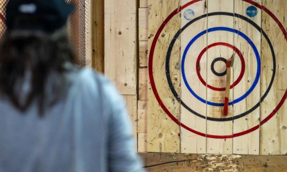 Axe on bullseye at axe throwing place