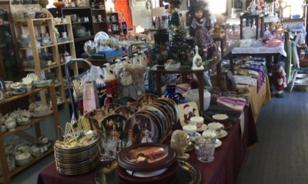 Assortment of vintage items displayed on table for sale